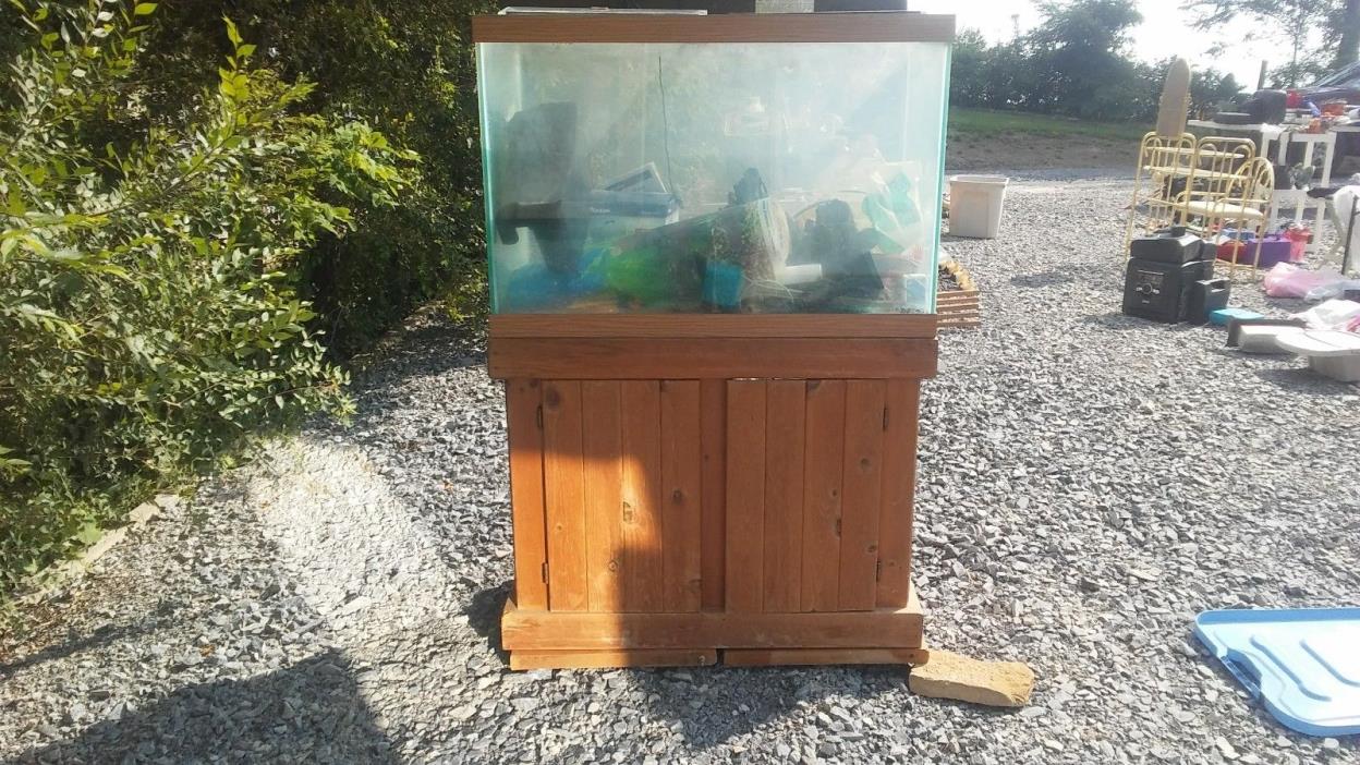 used 65 gal. fish tank w/stand, filter system, light and much more
