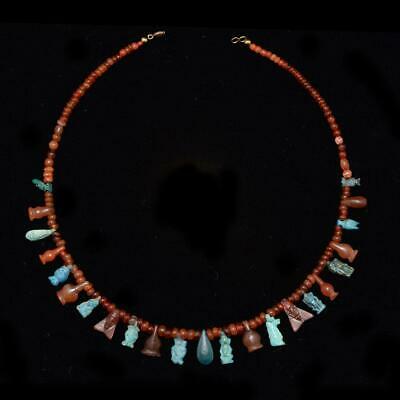 * An Egyptian Carnelian and Faience Bead and Pendant Necklace, New Kingdom, ca 1