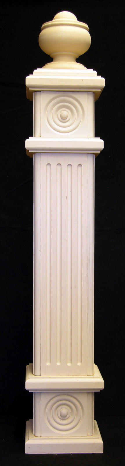 Victorian style newel post with fluted panels, and rosettes, and classic finial