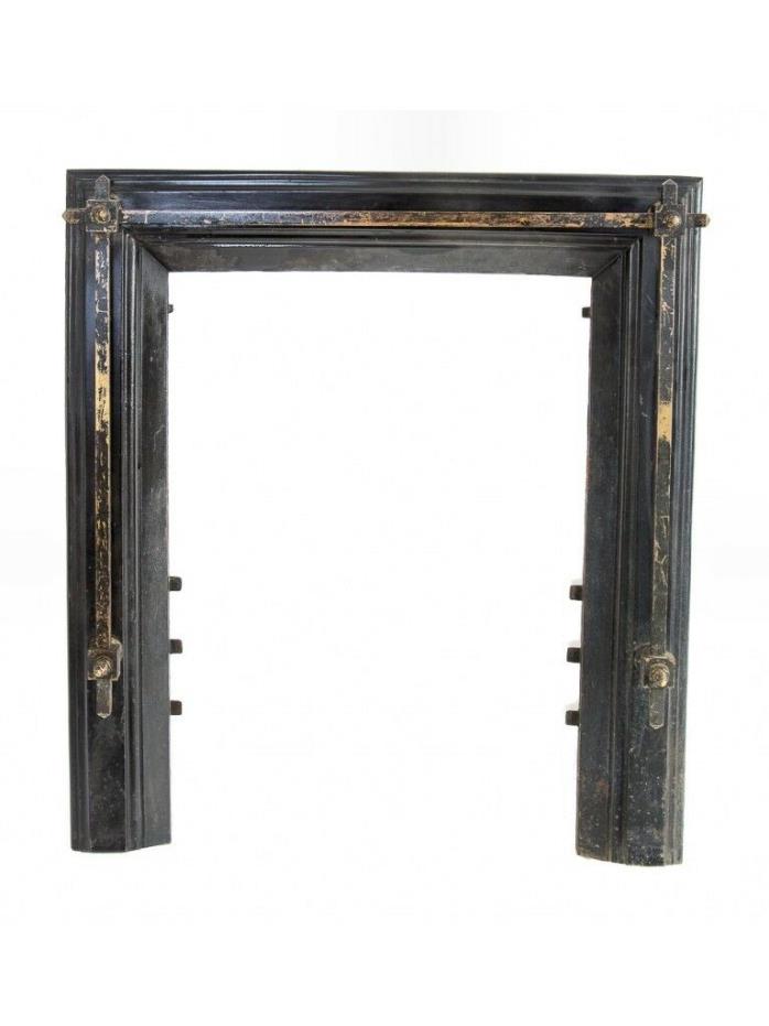 BLACK ENAMELED CAST IRON FIREPLACE SURROUND ADORNED WITH BRASS SQUARE-SHAPE RODS