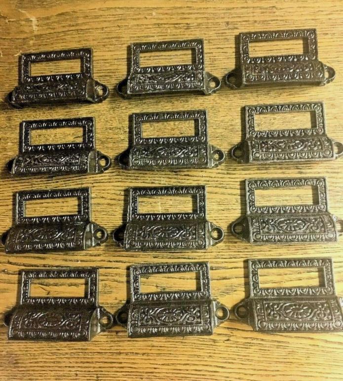 12 Antique Fancy Cast Iron Apothecary Bin/Drawer Pulls, c 1890's