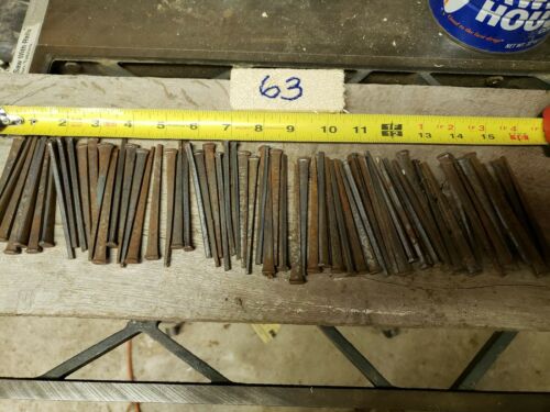 63 Antique 3 1/2 inch, square cut nails hand made unused, straight but rusty.