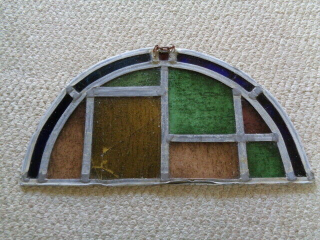 19th century half moon stained glass window blue amber green red tuquoise colors