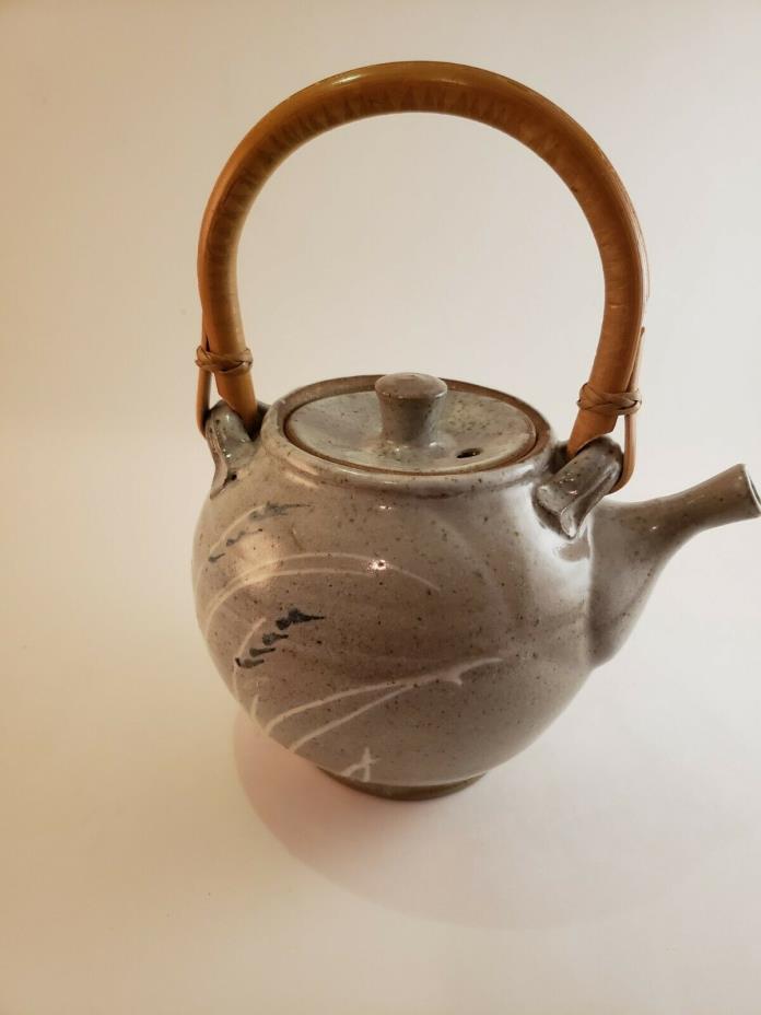 antique chinese tea pot with bamboo handle