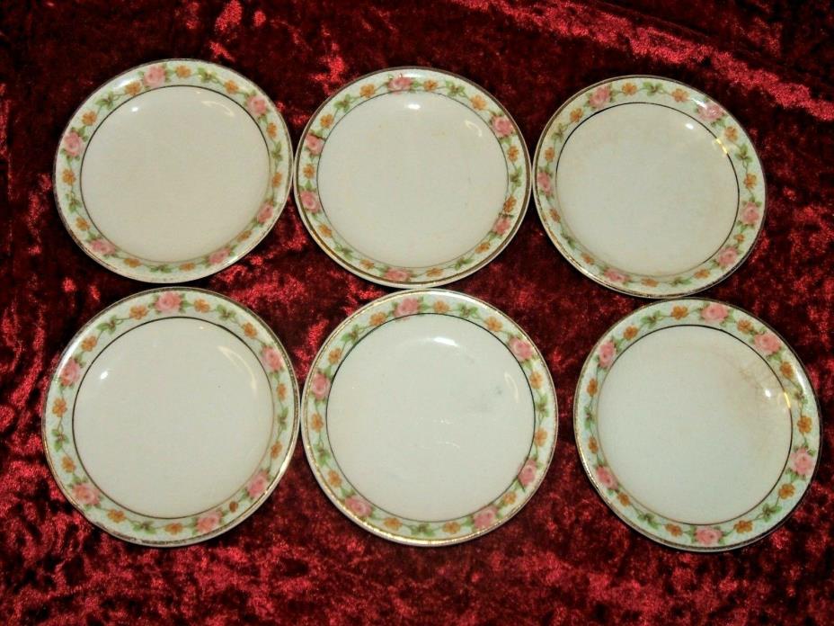 SET OF SIX    INDIVIDUAL BUTTER PAT DISHES