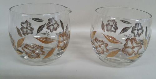Aimec glass sugar and creamer sets with gold design flowers.