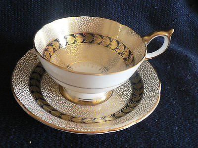 AYNSLEY TEA CUP AND SAUCER   ABSTACT  INTERTWINING GOLD DESIGN ON COBALT BLUE  N