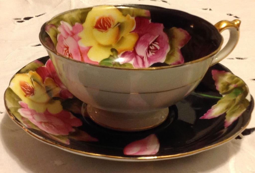 Taiyo teacup and saucer - black with bold pink & yellow roses