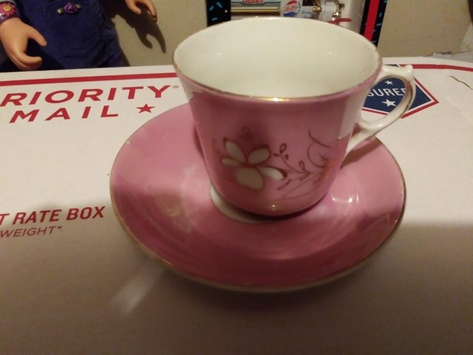 Old Tea cup Pinkish has interesting marks on bottom saucer smaller