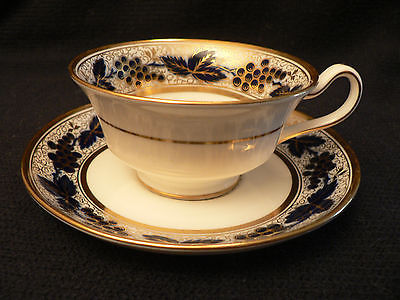 MINTONS TEA CUP AND SAUCER CPOBALT BLUE LEAVES AND GRAPES GOLD DESIGN ON WHITE