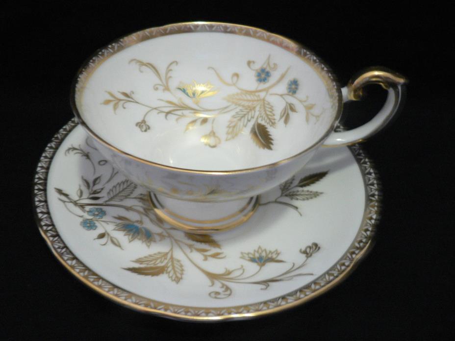 AYNSLEY TEA CUP AND SAUCER PEDESTAL IN WHITE GOLD LEAF TRIM WITH TEAL FLOWERS