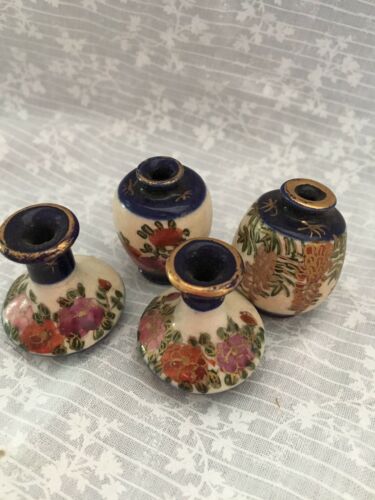 4 miniature porcelain pieces. Cobalt blue with flowers hand painted.  Two vases