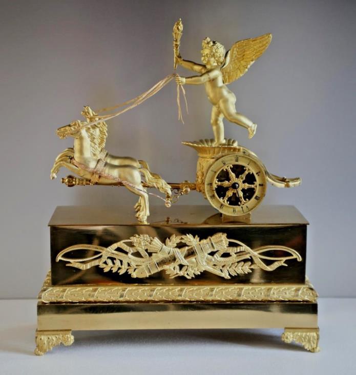 Cupid on a Chariot Empire period 19th century Gilded Bronze Clock