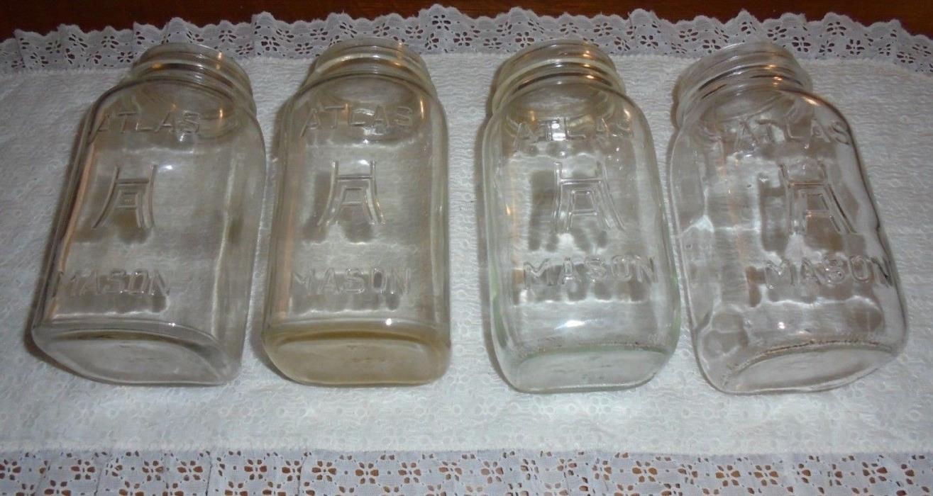 Four vintage square ATLAS MASON quart size clear jars, large H over A