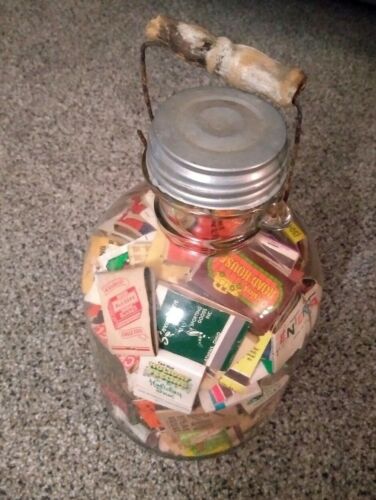Antique Farmhouse clear glass jug filled with vintage matchbooks