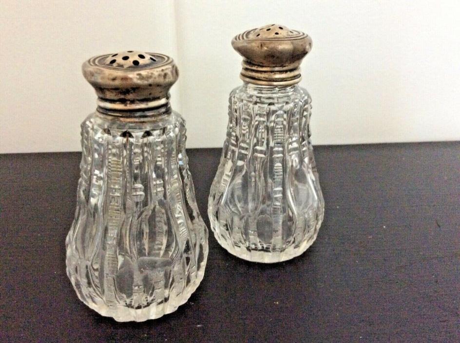Antique crystal salt and pepper shakers, zipper cut silver lids