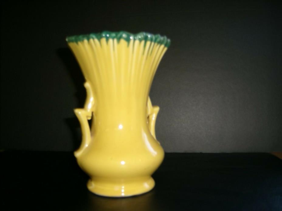 a antique McCoy Vase 7 inches high 5 inches wide at top 1950