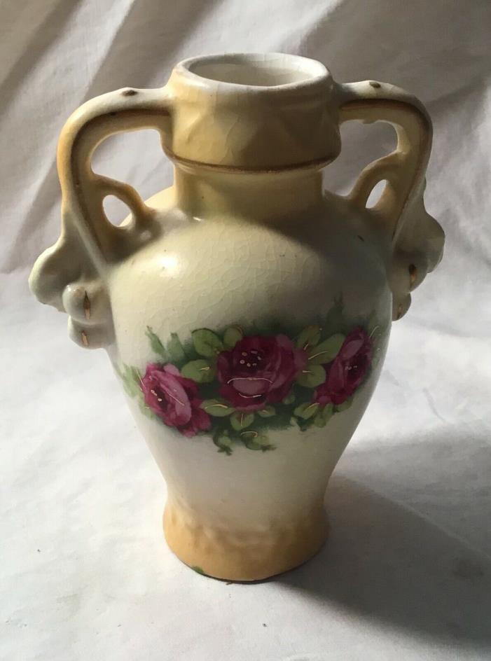 Antique vase with yellow flowers with Crown on bottom