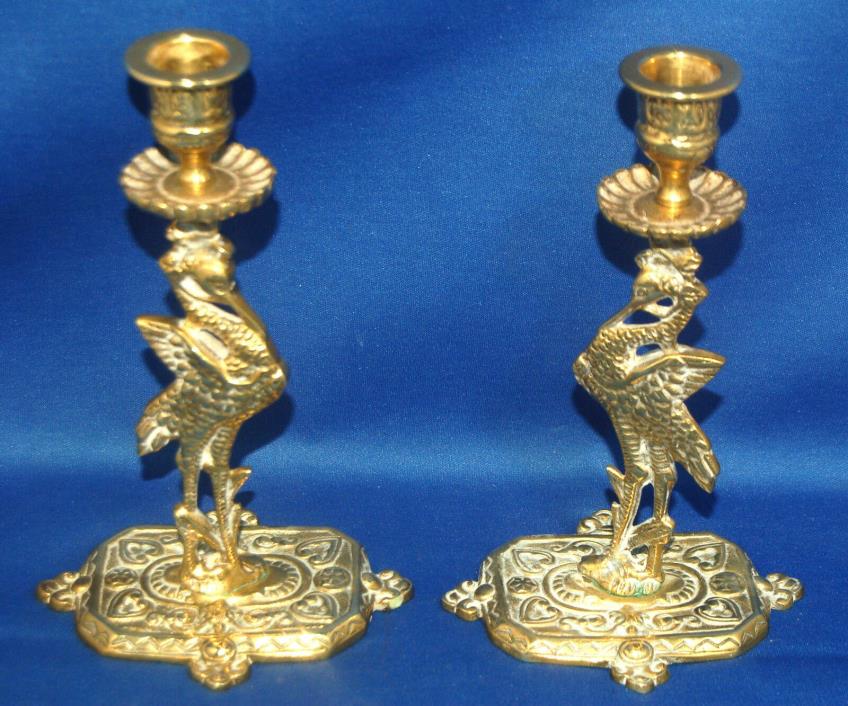 A rare pair of antique brass Victorian candlesticks modelled as storks or cranes