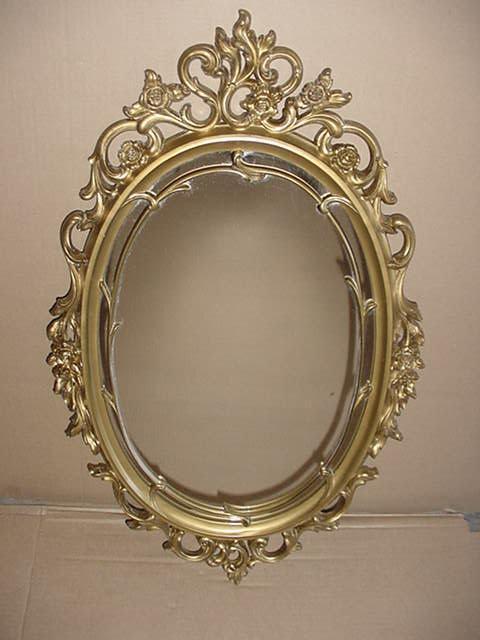 vintage syroco mirror hollywood regency style  with gold scroll floral design