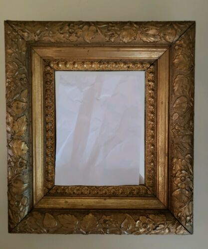 Fine Antique gilt mirror. Carved flowers leaves & vines on gold gilt wood frame.