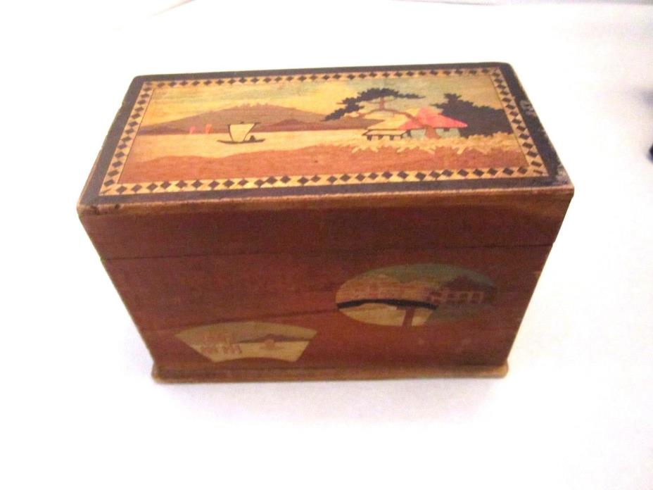 Wooden playing card storage box. Holds 2 decks. Inlaid Asian design. Hand carved