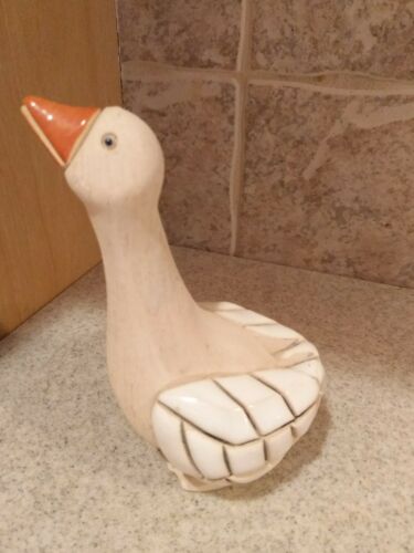 hand carved wooden goose with marble wings and ceramic beak. 5'' tall x 4'' wide