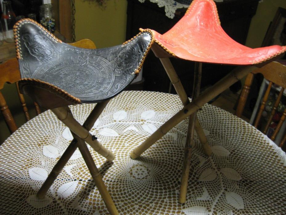 PAIR OF VINTAGE STOOLS TRIPOD MAYAN BAMBOO TOOLED RED BLACK LEATHER