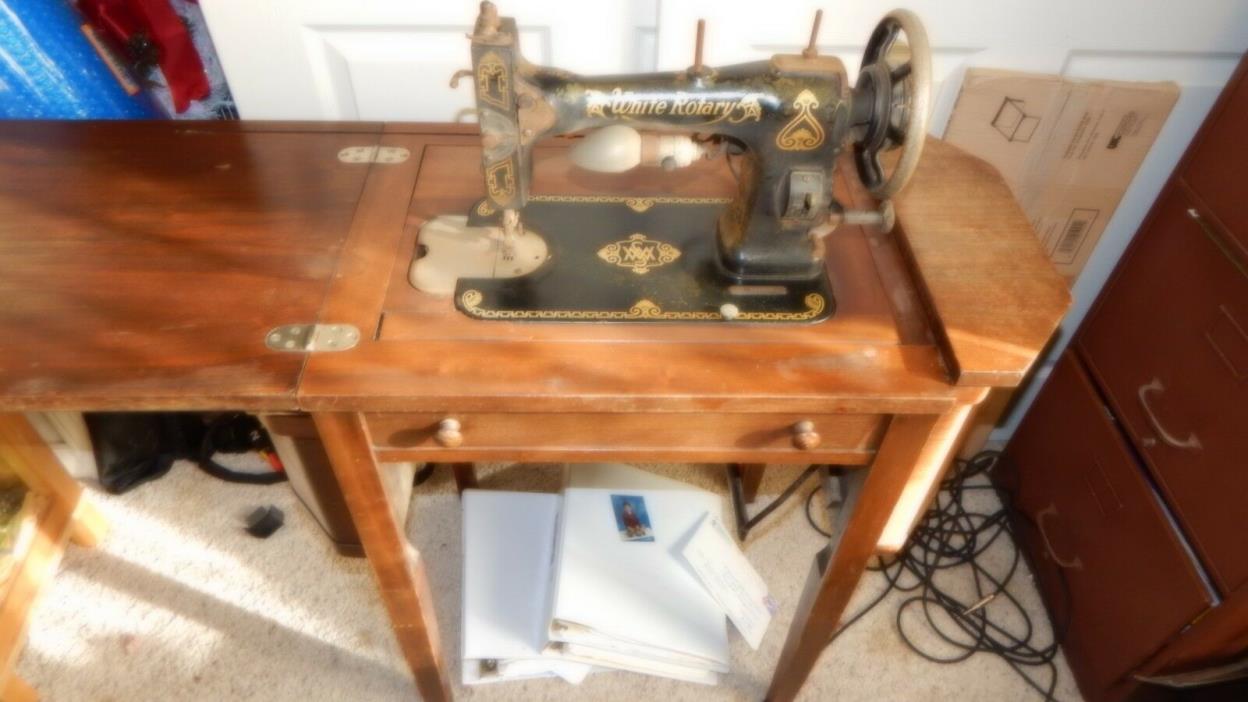 Antique Martha Washington sewing machine and cabinet