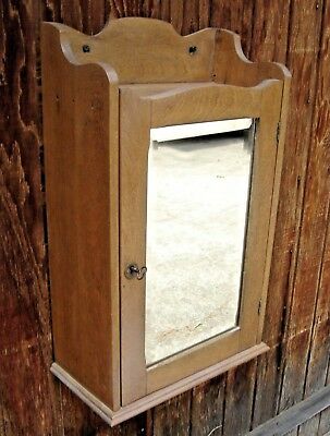 Antique Chestnut Medicine Cabinet with Beveled Mirror Door has a lock 478