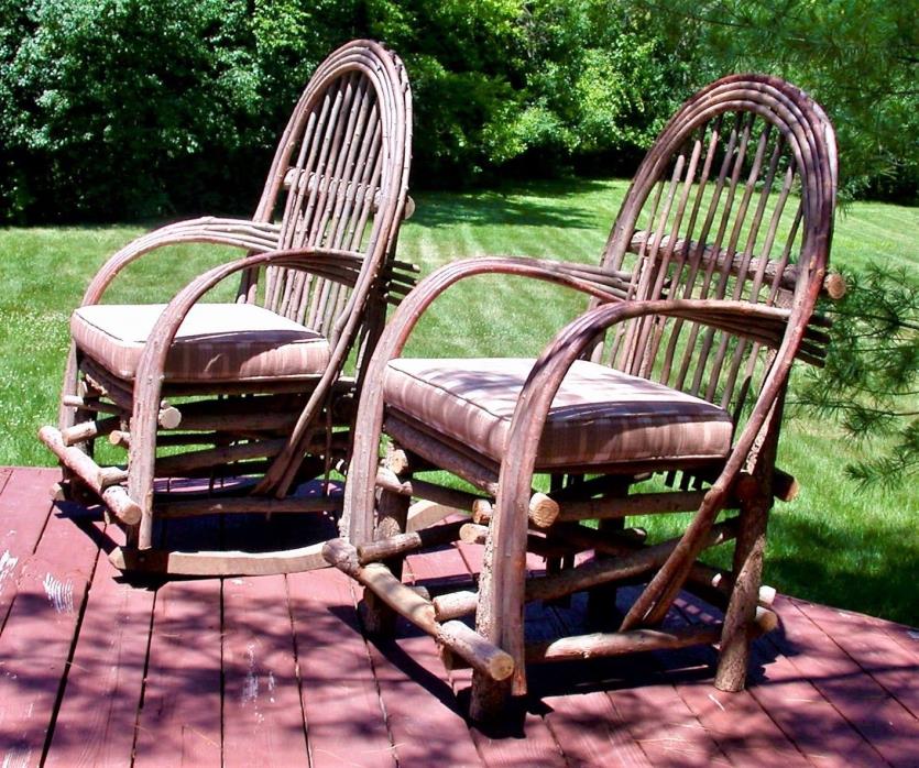 Two bent willow chairs with cushions, one of which is a rocking chair