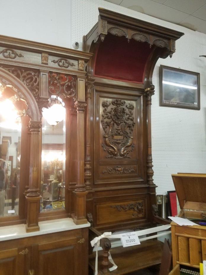 11' tall Griffin chairs heavily carved.