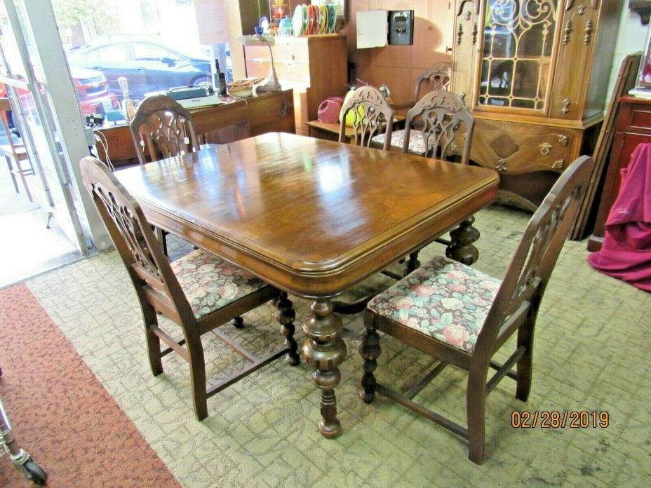 Jacobean dining table with 3 leaves, six chairs and table pads