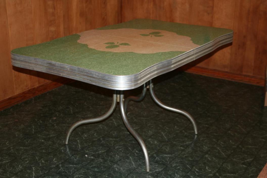 vintage 1950's kitchen table, chrome with Formica top, green w leaf pattern