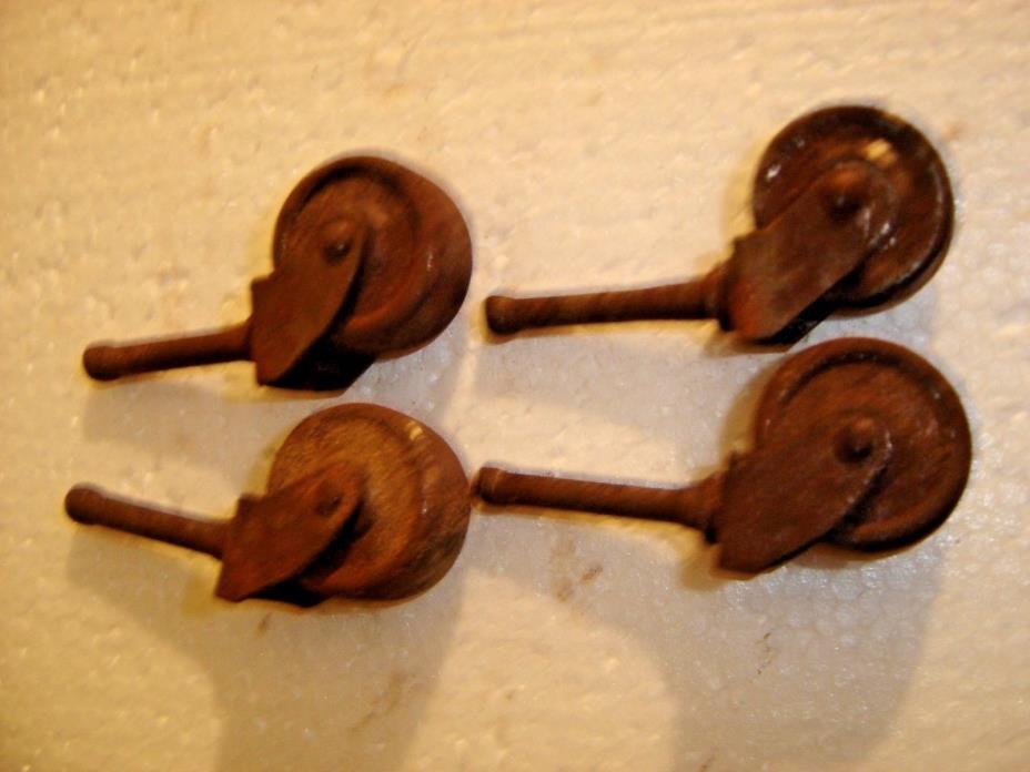 Set of 4 metal Antique casters They show some rust and still turn freely 9939
