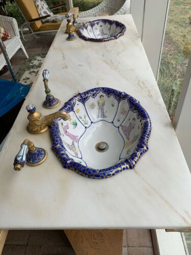 Sherle Wagner sinks With Matching Faucets And Marble Slab