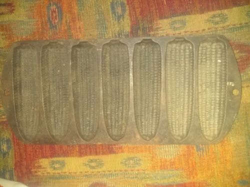 Antique CAST IRON CORN BREAD PAN labeled A. 1930s to 1940s. 18in by 6 in