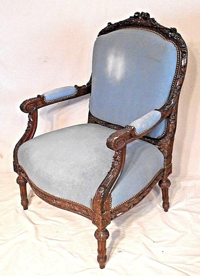 A GREAT OVERSIZE HAND CARVED VICTORIAN LOUIS XVI WALNUT UPHOLSTERED ARMCHAIR