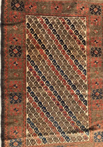 AN ATTRACTIVE IVORY BACKGROUND COLOR BALOOCH TRIBAL RUG