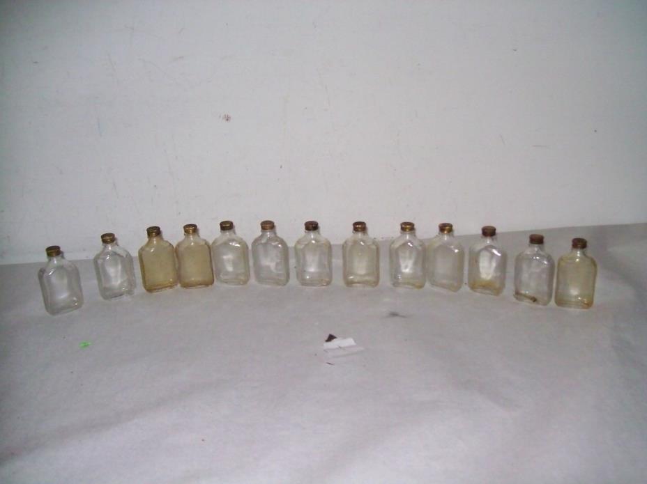 Lot of 13  vintage pharmacy  medicine bottles with brass caps ,early 1900's