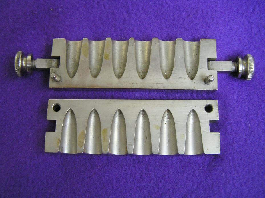533. Stainless steel medical suppository mold.
