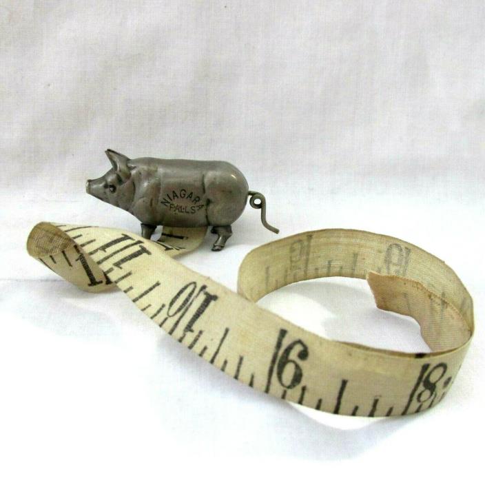Antique Figural Tape Measure & Niagara Falls Souvenir Brass Pig Wind Up Tail
