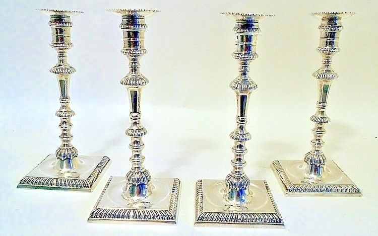 A good set of 4 cast sterling silver candlesticks, Ebenezer Coker, London 1762.