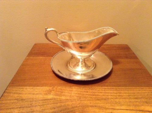 Antique Middletown Silverplate gravy boat with plate and ladle beaded design