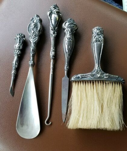 Sterling Silver Set. Brush, Shoe Horn, File, pic and button hook.