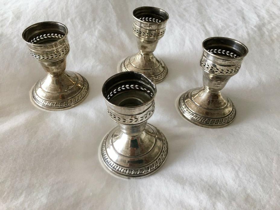 Set of 4 identical Sterling Silver Weighted Candle Sticks marked 