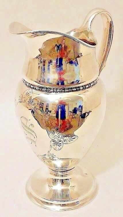 A tall sterling silver water pitcher, Tiffany & Co., New York, c.1902-7.