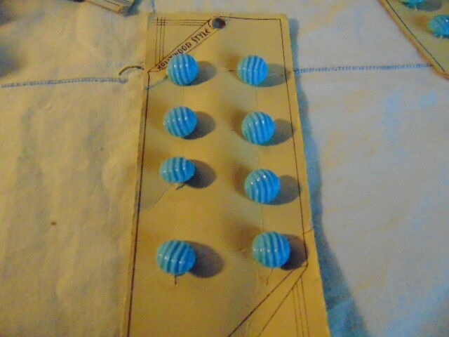 Eight Small Light Blue Glass Shank Buttons on Card