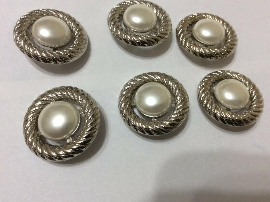 A Lot of 6 Round Silver and Cream Buttons