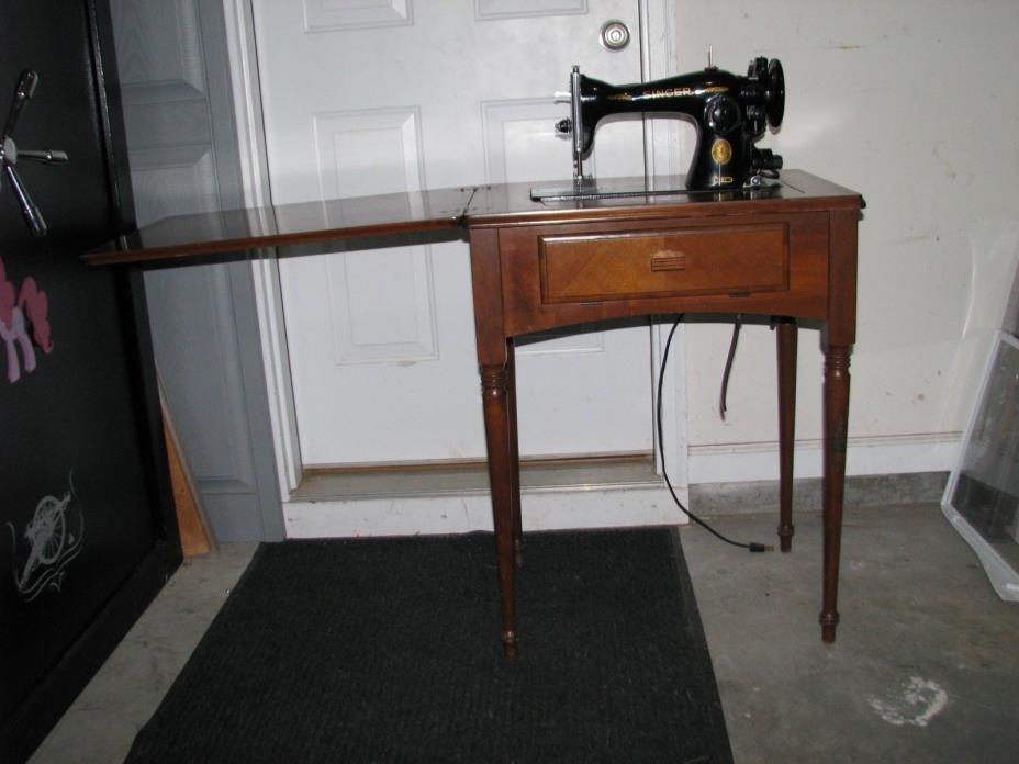 Singer sewing machine with cabinet Model #15-91, Serial# AD564072, Cabinet#975D